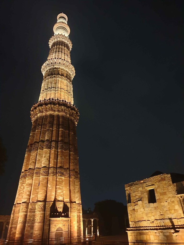The Qutub Minar lit up at night. 